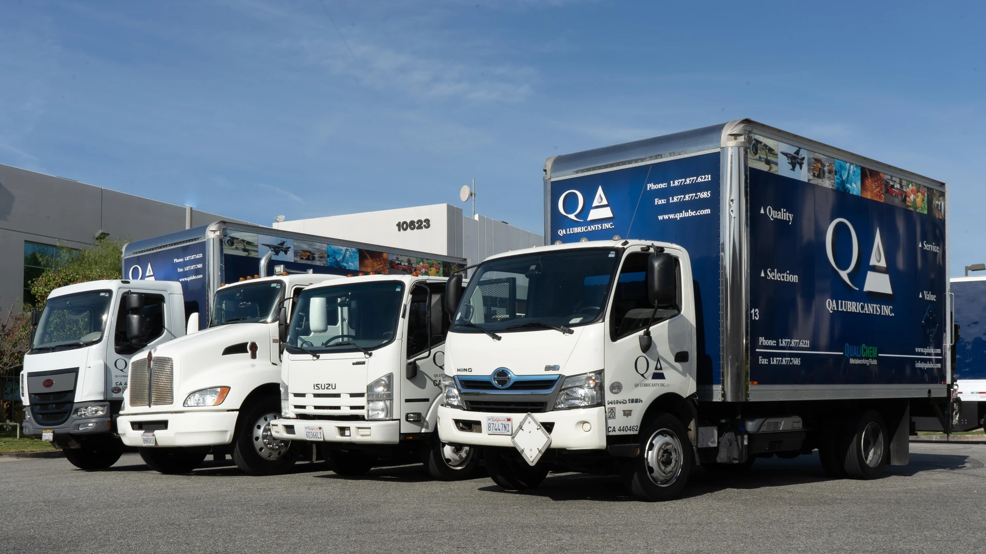 QA Lubricants delivery fleet lined up outside the warehouse